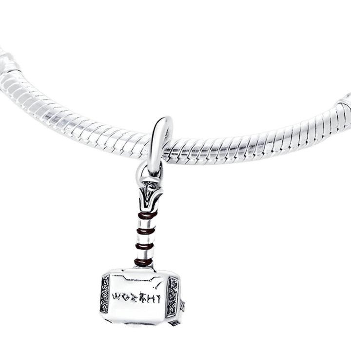 Marvel Thor Hammer Mjolnir Dangle Charm on a silver bracelet showcasing detailed craftsmanship.