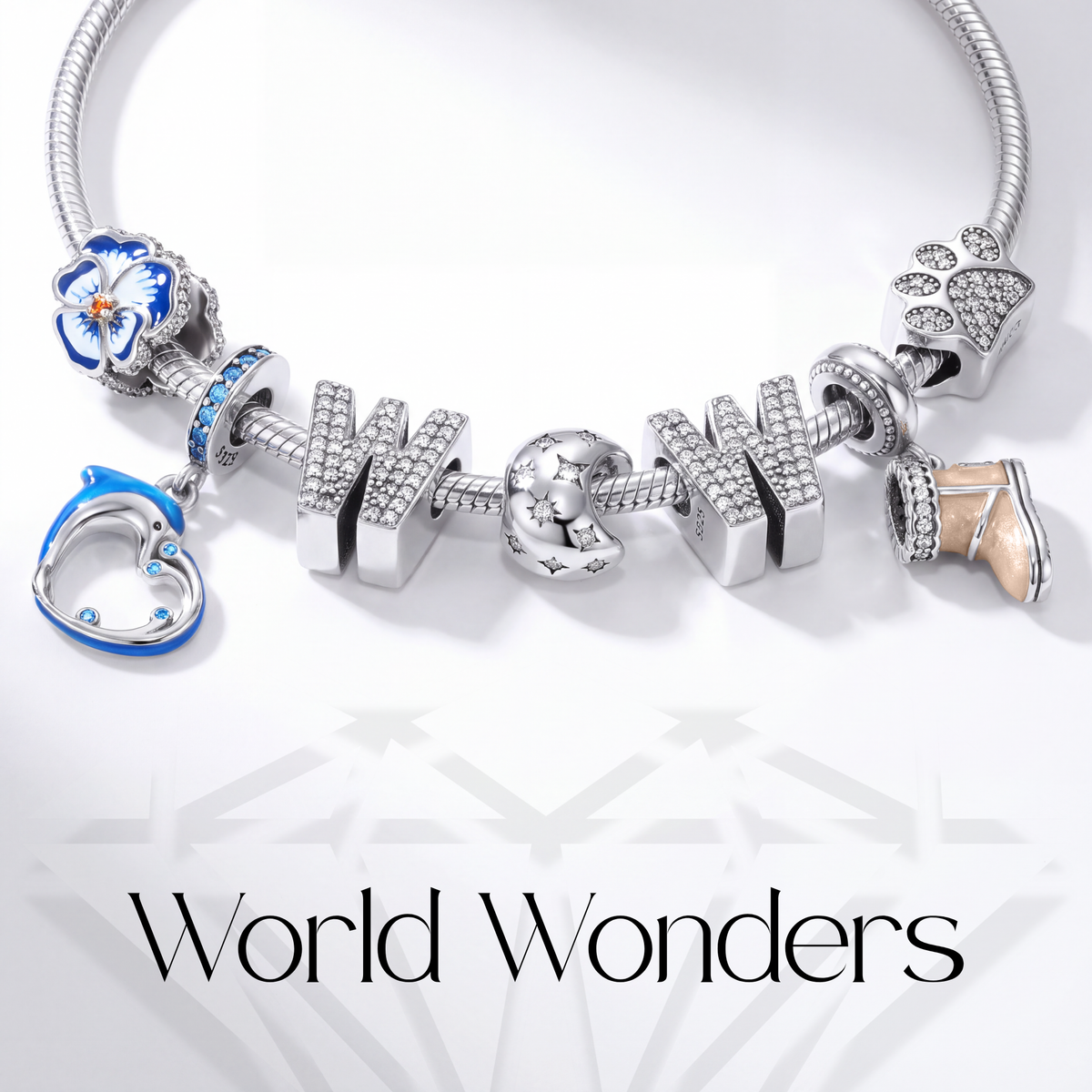 Close-up of a charm bracelet featuring letters and symbols from the World Wonders collection.