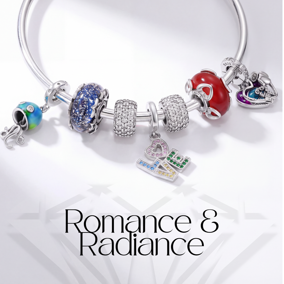 Romance & Radiance charm collection featuring colorful and sparkling charms on a bracelet.