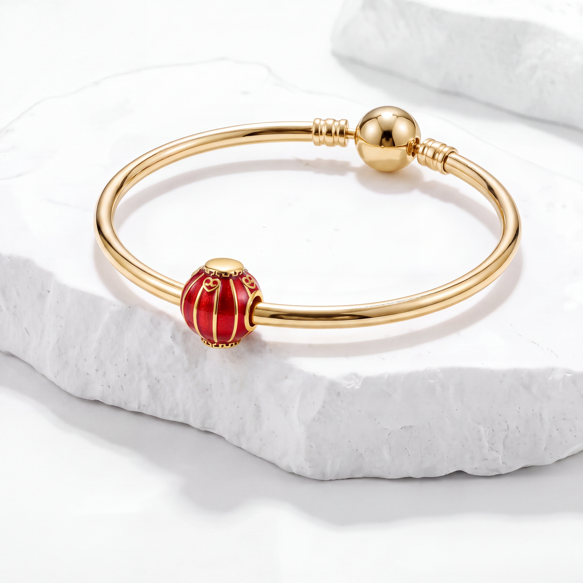 Gold bangle bracelet featuring a red lantern charm from the Lunar Charms collection.