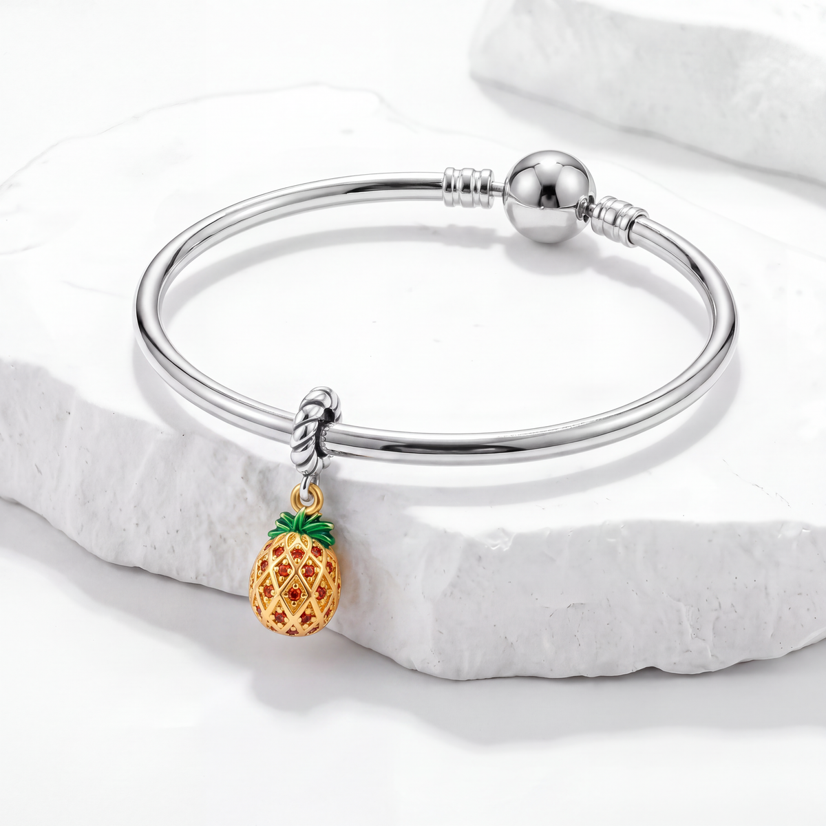 Food and Drinks Charms bracelet featuring a playful pineapple charm on a marble background.