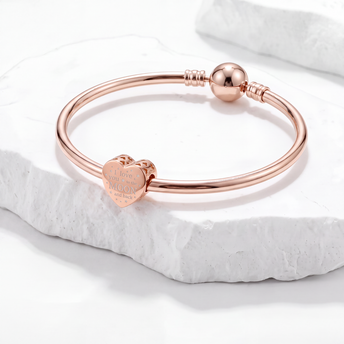 Rose gold bracelet featuring a heart charm "I love you to the moon and back" from the love and heart charms collection.