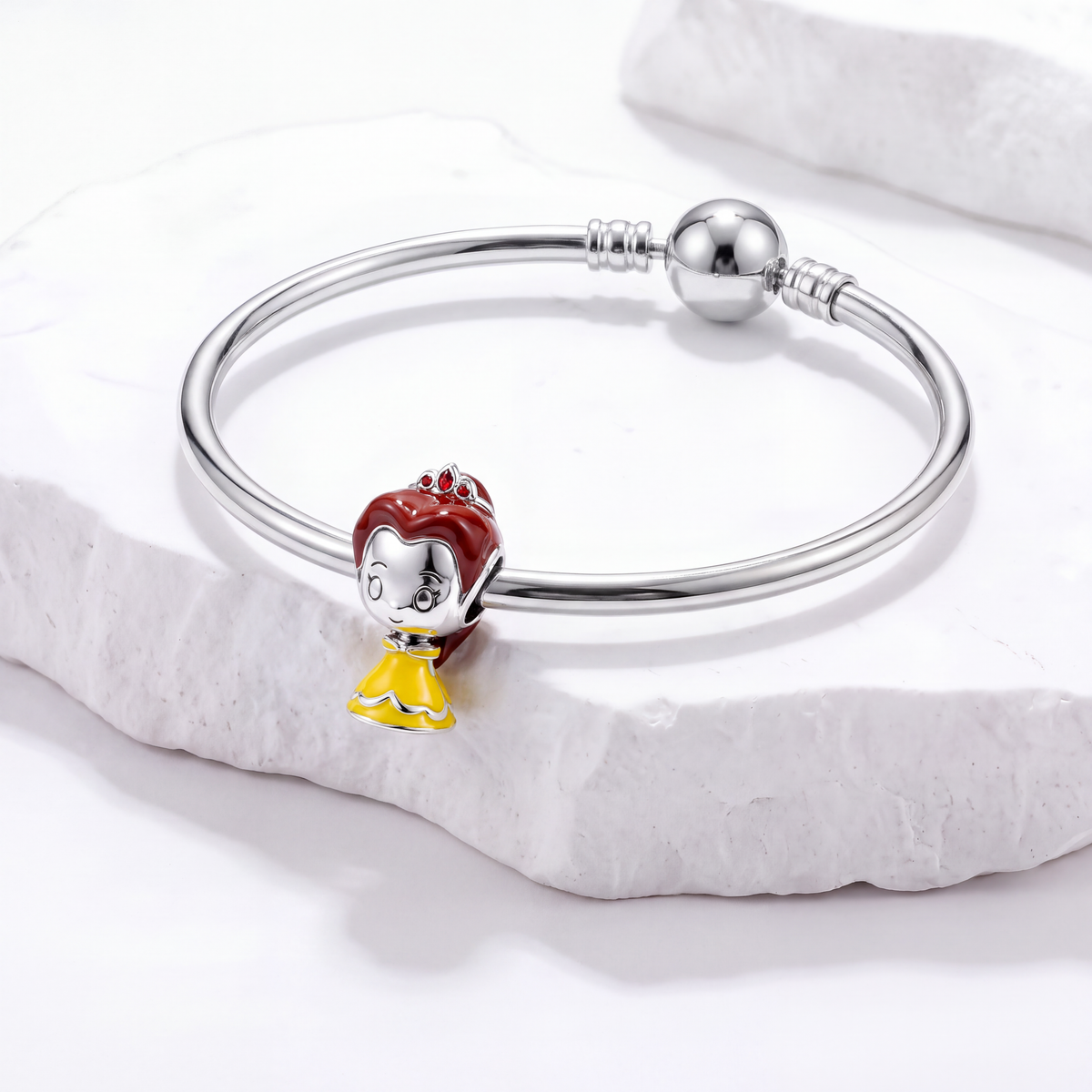 Disney charms featuring Belle from Beauty and the Beast on a silver bracelet, embodying magic and true love.
