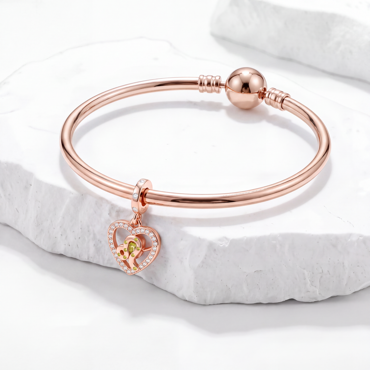 Zodiac and Birthstone charms heart shot charm on rose gold bracelet, showcasing birthstone and zodiac symbol.
