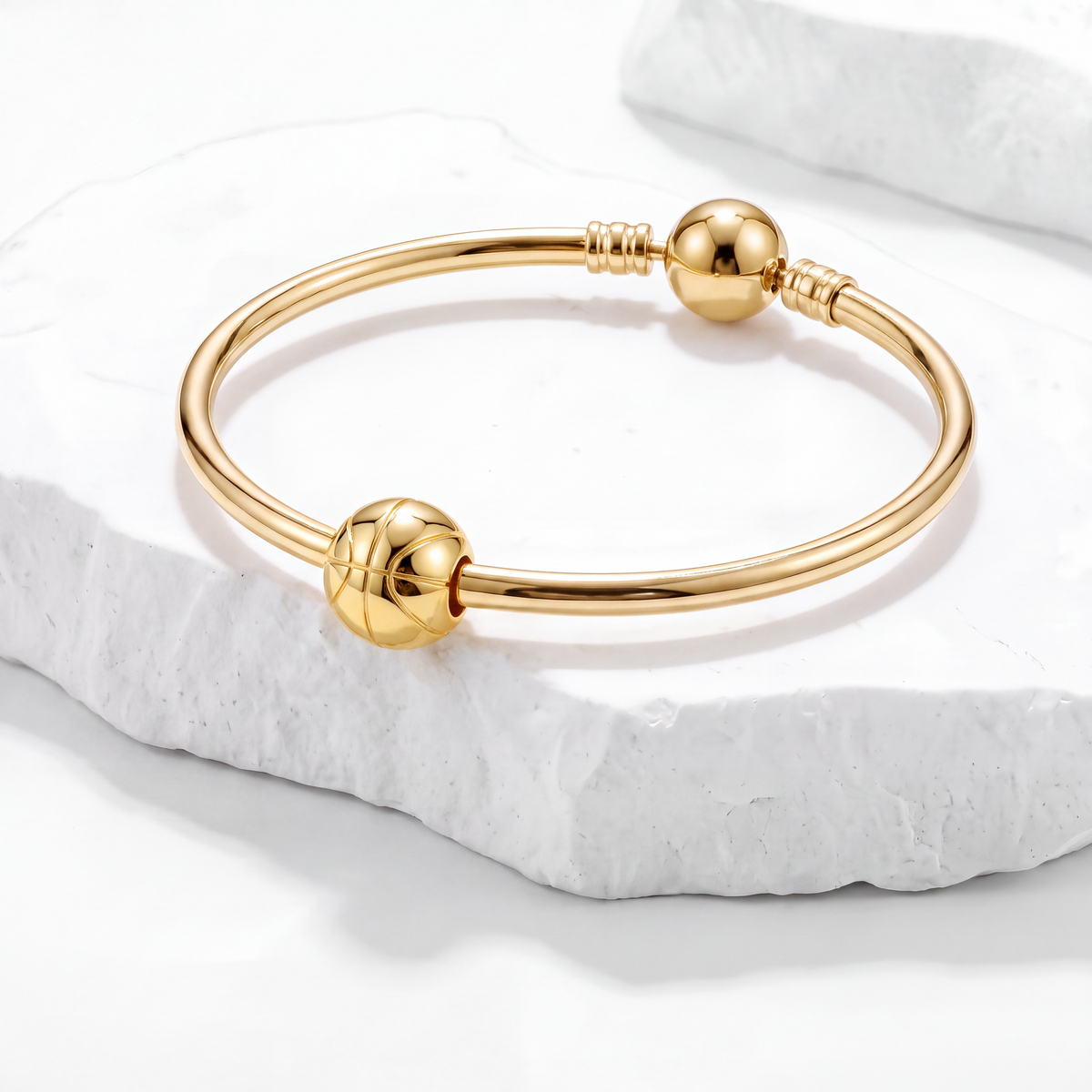 Gold bracelet featuring sporty charm design, perfect for those who love Sport Charms.