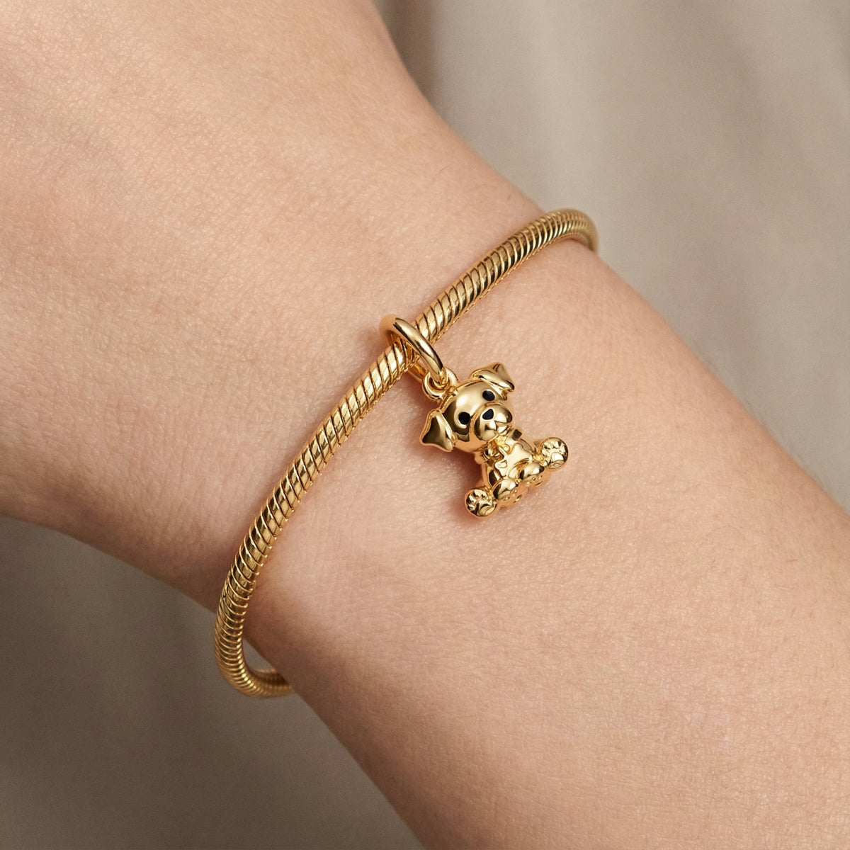 Golden Cute Puppy Pendant on a bracelet, symbolizing love and companionship for dog lovers.