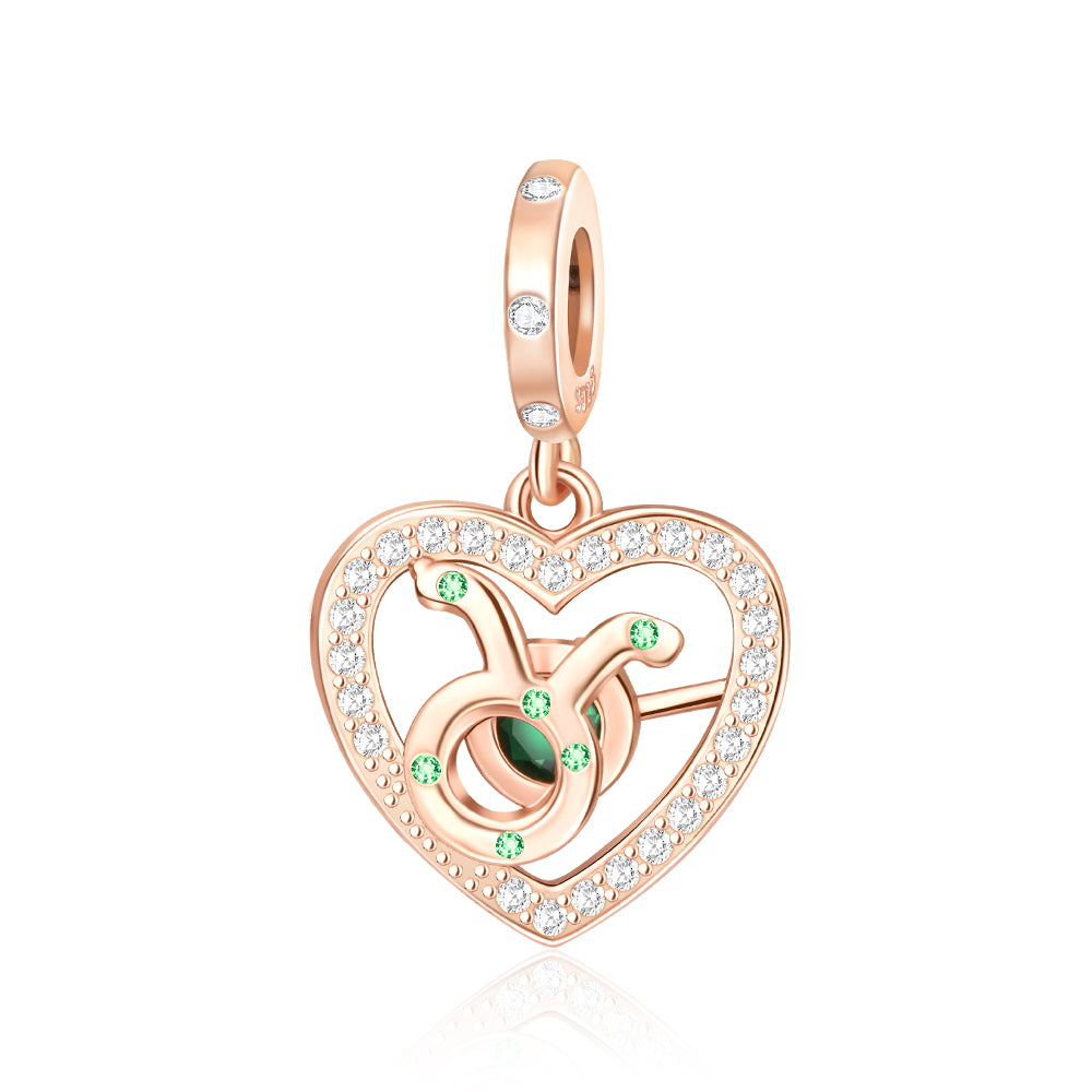 Rose Gold Sparkling Taurus Dangle Charm with emerald green accents and pavé crystals in a heart design.