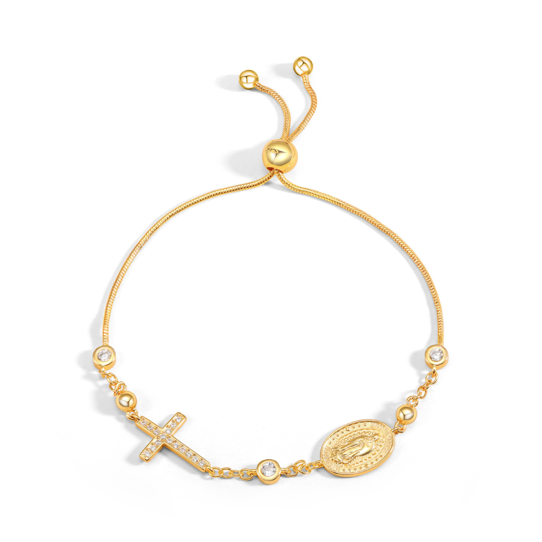 Gold Cross and Virgin Mary Slider Bracelet featuring a crystal-studded cross and a polished gold finish.