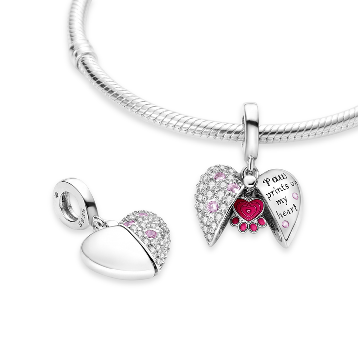 Paw Prints On My Heart Locket Dangle Charm featuring a sparkling heart with pink stones and an enamel paw print inside.
