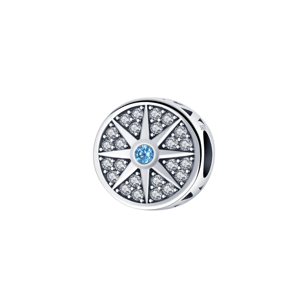 Always Find Your Way Compass Rose Charm with sparkling rays and a blue center stone, symbolizing guidance and adventure.