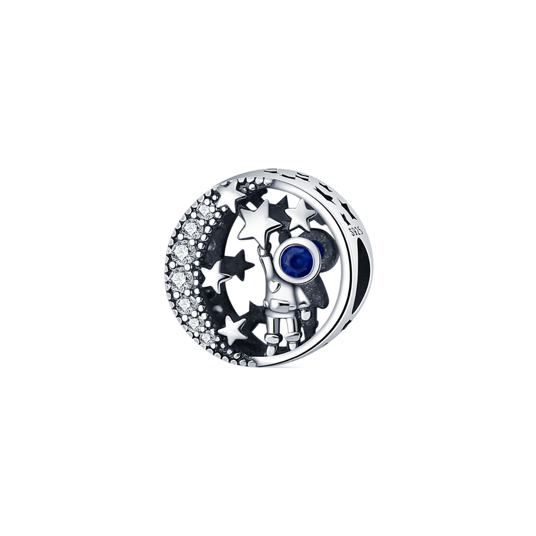 Among The Stars Astronaut Charm featuring a silver astronaut with blue sapphire helmet and star-scattered disc.