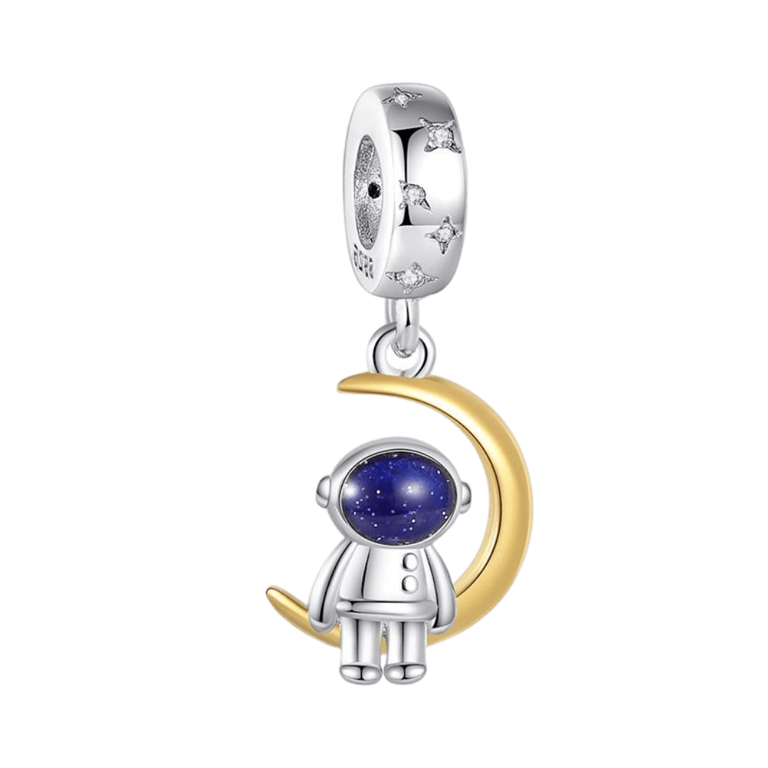 Astronaut Sitting On The Moon Dangle Charm ( DISCONTINUED ) on a golden moon with a blue face shield.
