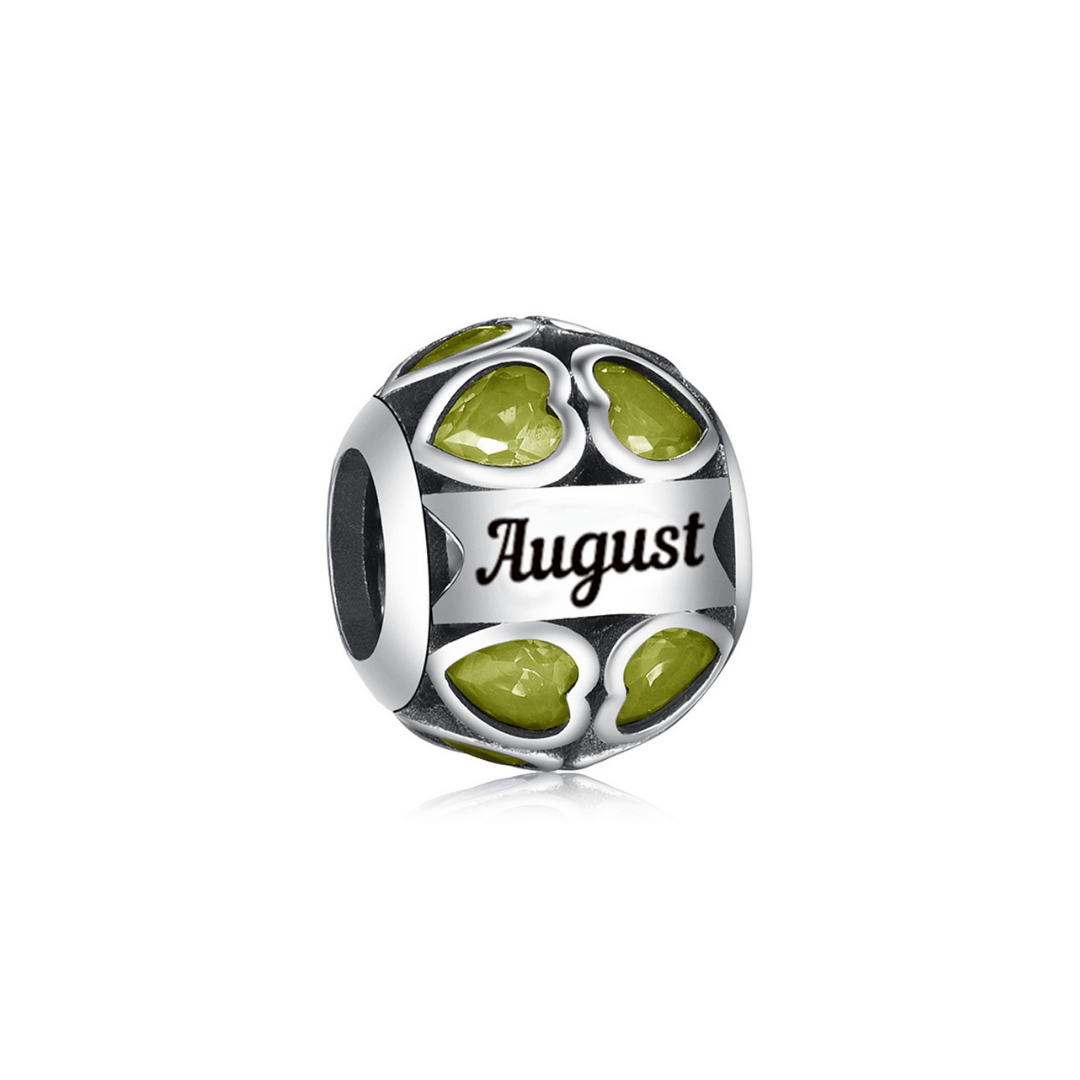 August Birthstone Heart Charm featuring vibrant green stones and 'August' inscription.