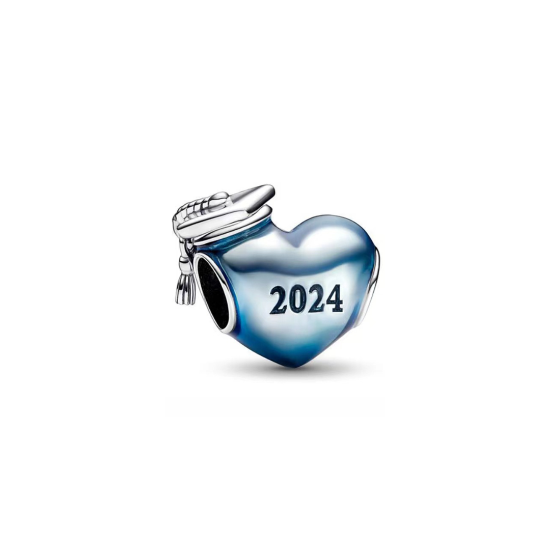 Blue 2024 Graduation Heart Charm (DISCONTINUED) with detailed graduation cap and heart design.