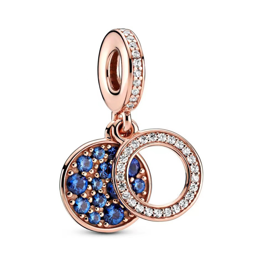 Blue Rose Gold Sparkling Double Circle Dangle Charm ( Discontinued) featuring blue pavé stones and clear sparkling stones.