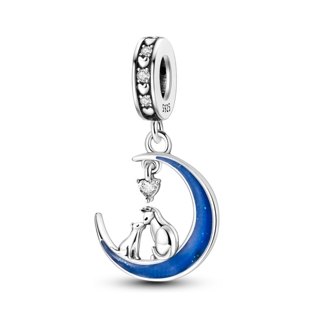 Cat and Dog Moon Love Glow Dangle Charm featuring a cat and dog on a blue crescent moon with heart crystal.