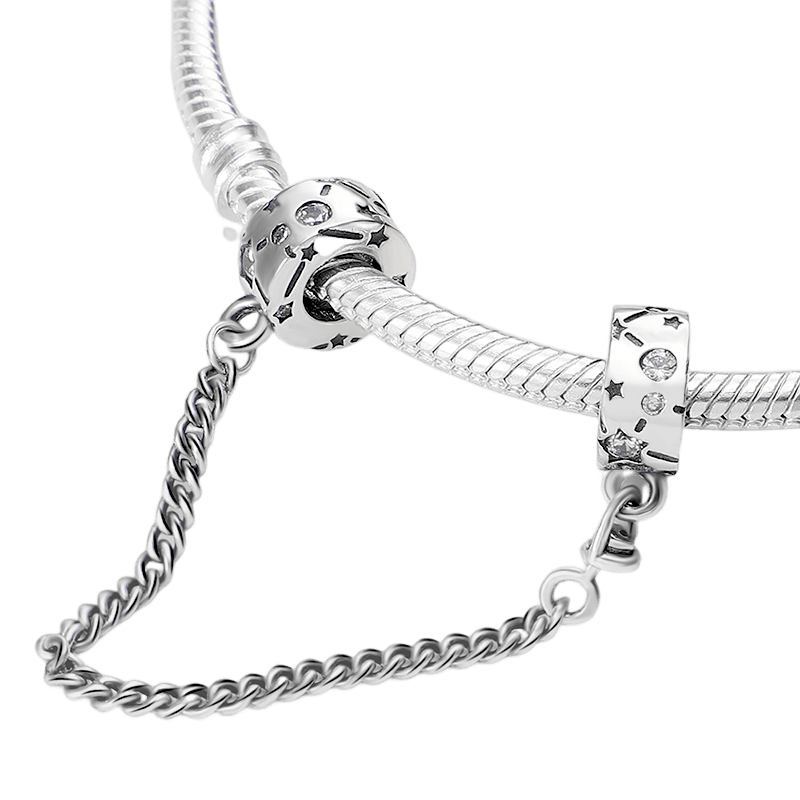 Celestial Stars Safety Chain with silver curb chain and star motif clip beads, adorned with clear stone accents.