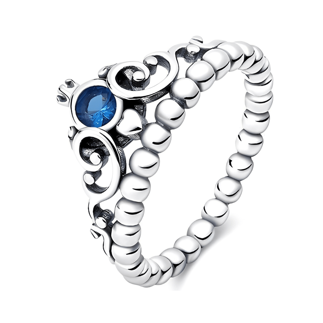 Cinderella- Blue Tiara Ring (DISCONTINUED) featuring a blue gemstone and delicate beaded band design.
