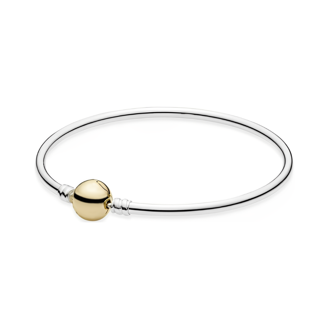 Classic Two Tone Gold Bangle featuring a sleek design with a gold accent, perfect for stacking or wearing alone.