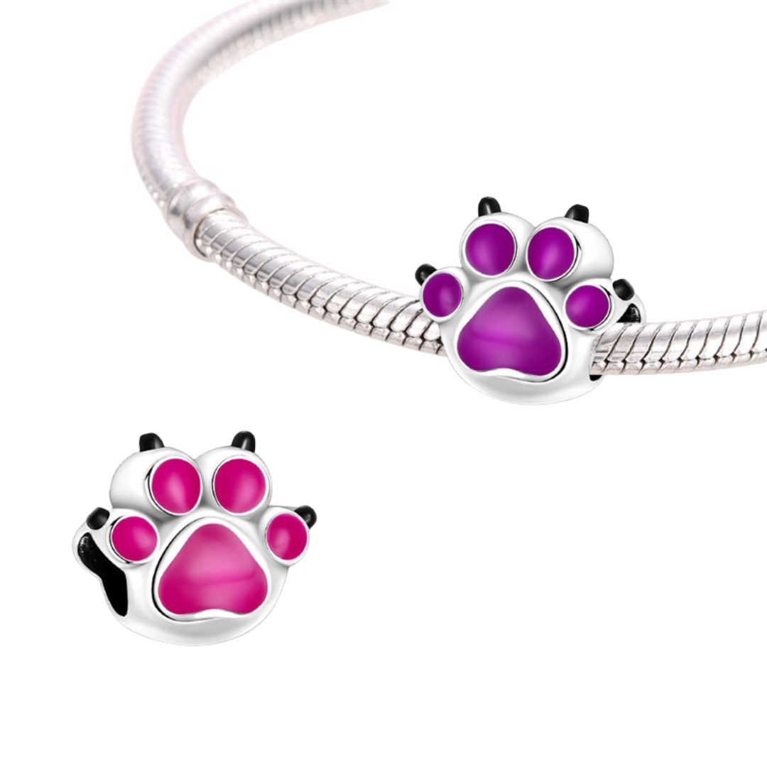 Colour Change Pet Paw Print Charm featuring vibrant purple enamel pads and black claw details on a silver bracelet.