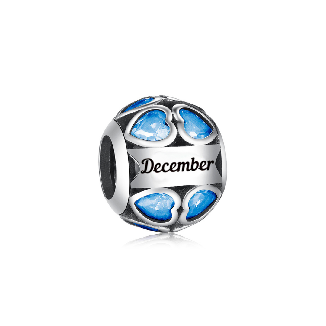 December Birthstone Heart Charm featuring blue heart-shaped stones and engraved 'December' design.