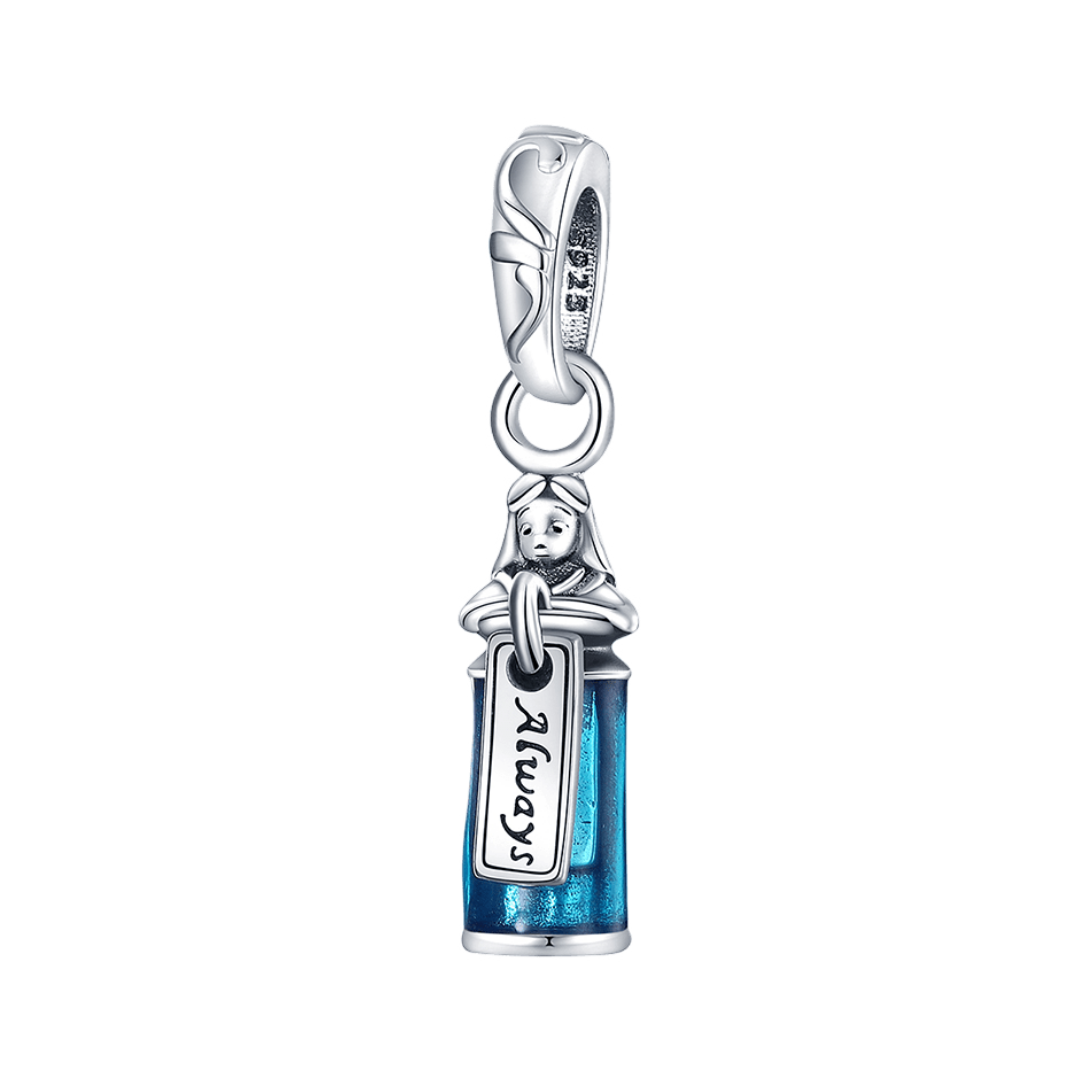 Disney Alice in Wonderland Drink Me Dangle Charm featuring Alice and blue-toned bottle design.