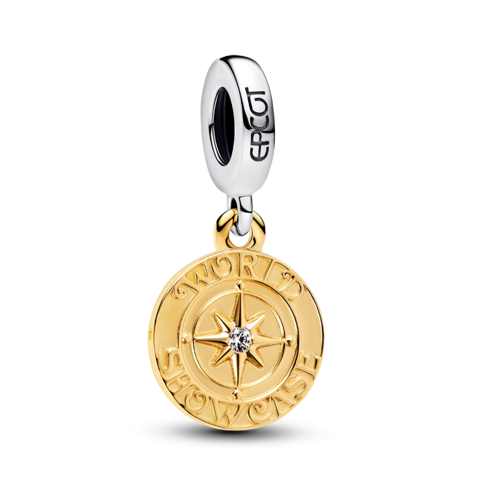 Epcot dangle charm featuring a golden disc with compass star and 'World Showcase' engraving.