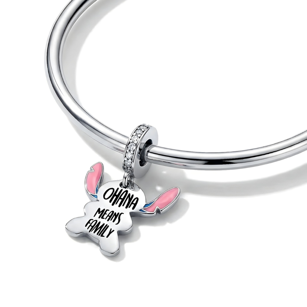 Disney Lilo and Stitch Ohana Family Dangle Charm ( DISCONTINUED) on a bracelet, featuring the words 'Ohana Means Family'.
