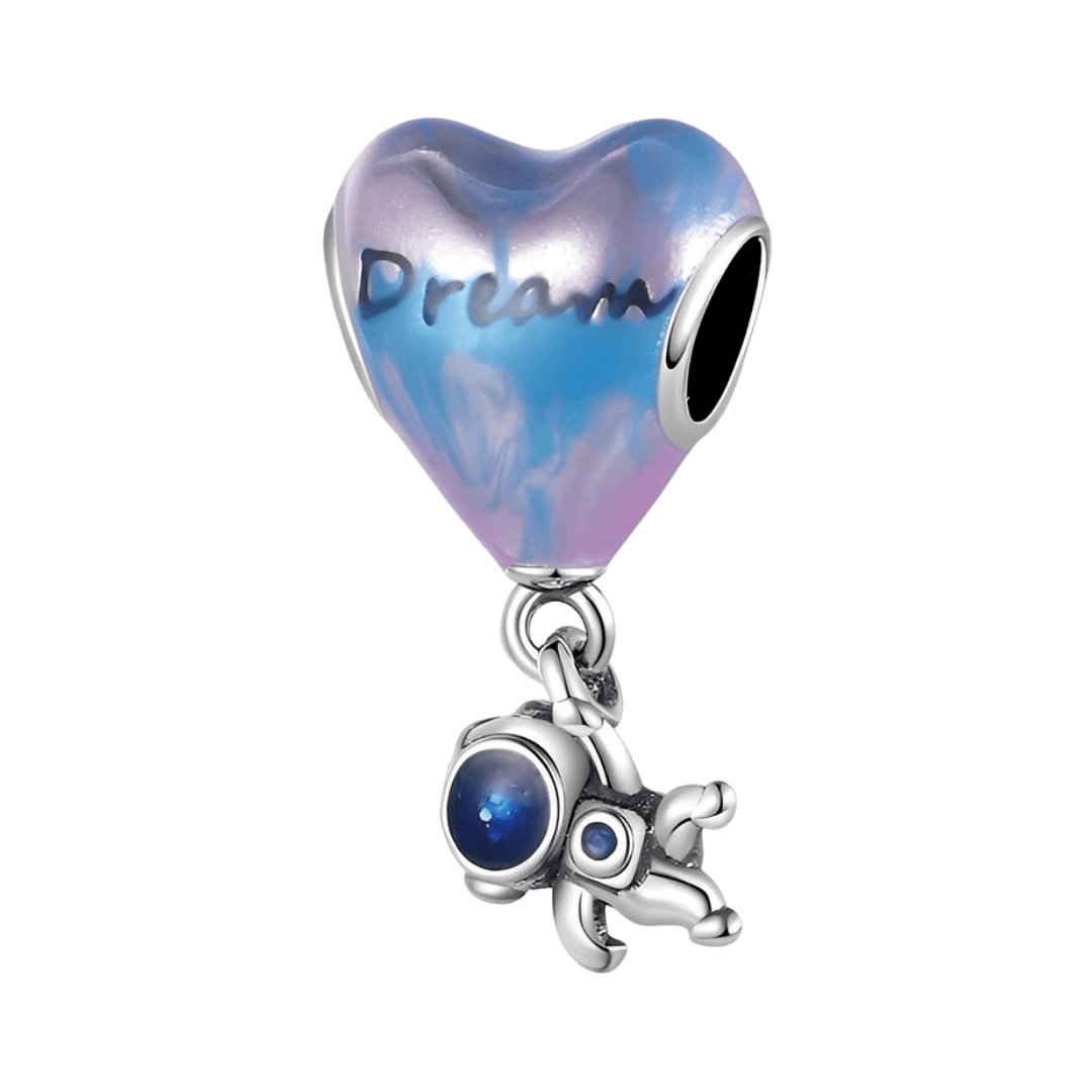 Dream Astronaut Heart Dangle Charm featuring a heart bead with 'Dream' and an astronaut charm.