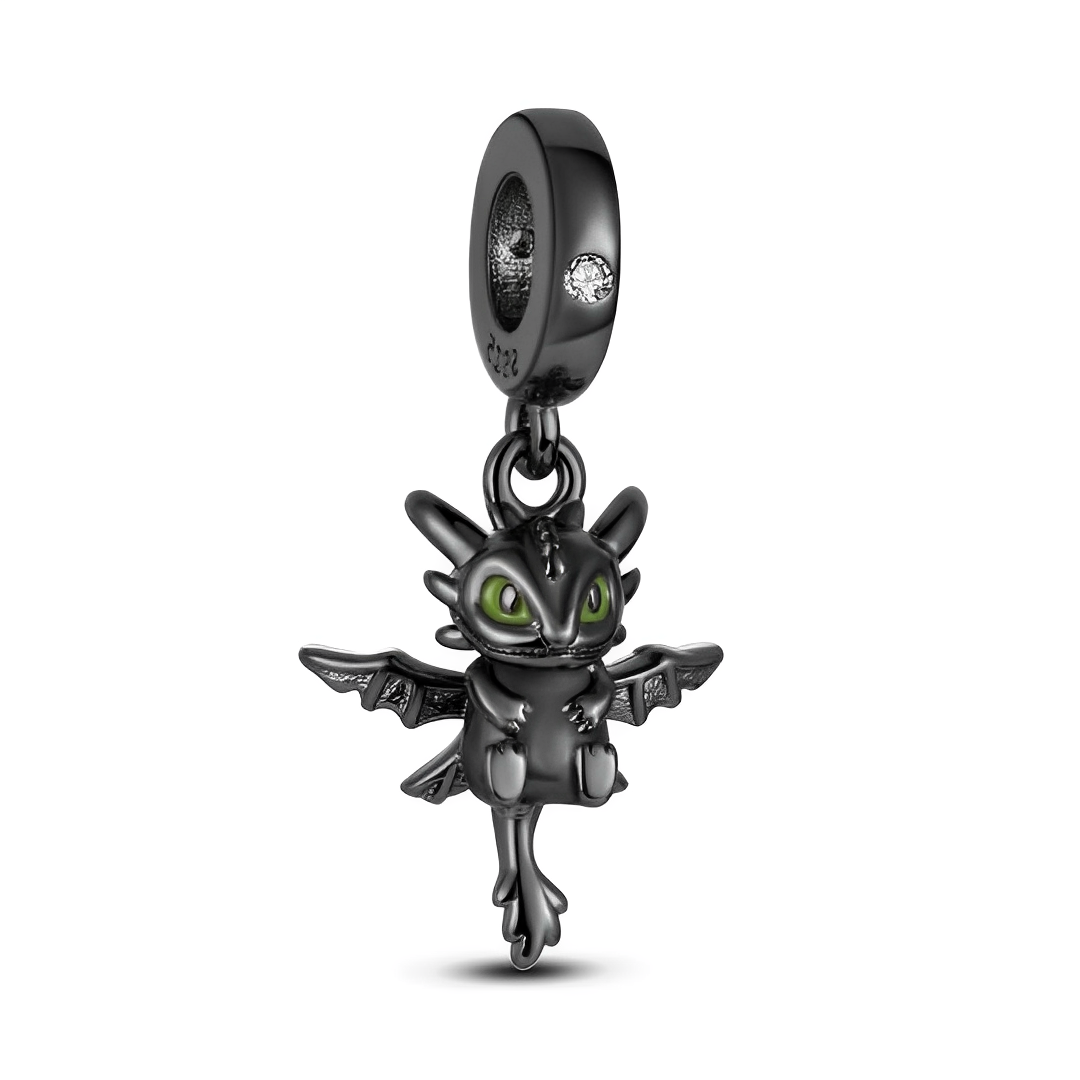 DreamWorks How to Train Your Dragon Toothless Dangle Charm in dark oxidized black with vivid green enamel eyes.