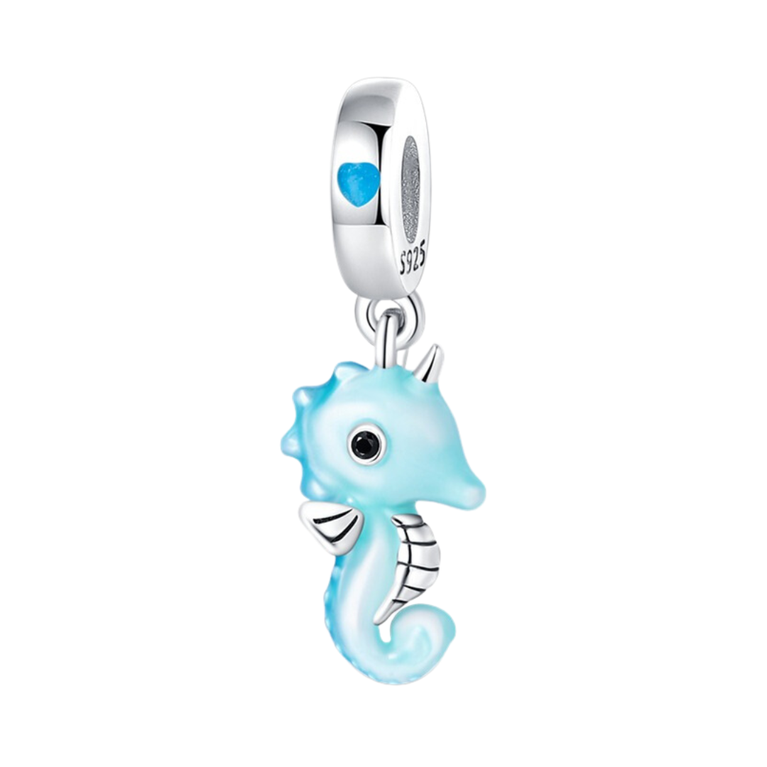 Glow Baby Seahorse Dangle Charm in soft aqua blue enamel with silver details and a glowing finish.