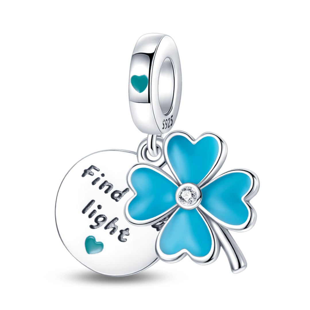 Glow In The Dark Clover Dangle Charm featuring a blue four-leaf clover and engraved disc saying 'Find light'.