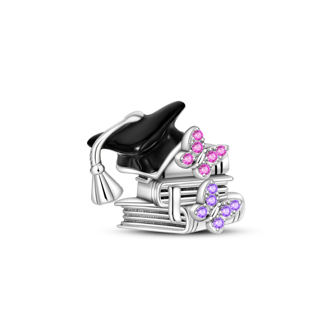 Graduation Books and Butterflies Charm featuring a graduation cap and colorful butterfly details.