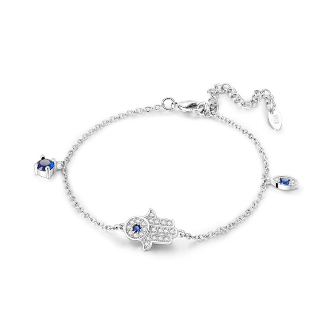 Hamsa Hand Evil Eye Bracelet featuring delicate design with blue gemstones and silver chain, perfect for everyday wear.