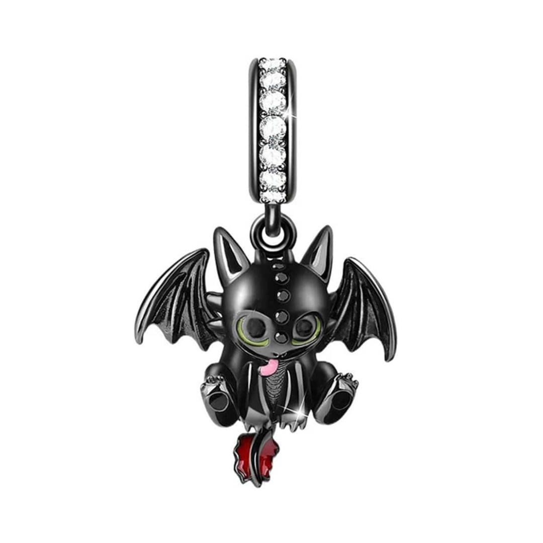 How To Train Your Dragon Sparkling Toothless Dangle Charm with black wings and tongue out, showcasing its playful design.