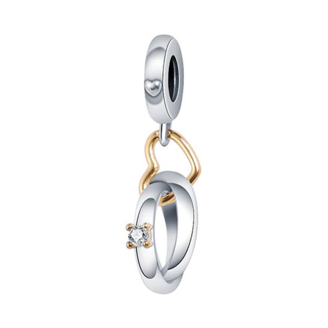 Interlocking Wedding Rings Heart Dangle Charm featuring silver and gold intertwined rings with a sparkling crystal.
