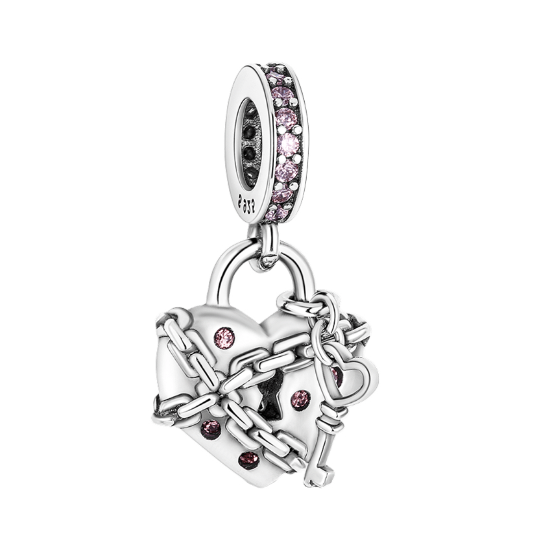 Locked Heart Dangle Charm (DISCONTINUED) with pink zircon accents and chain design.
