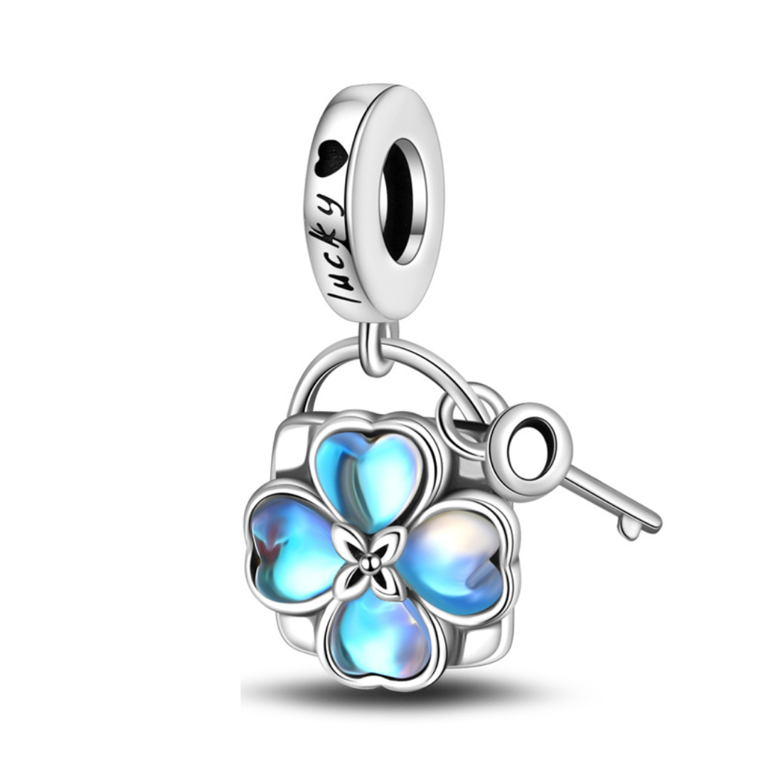 Lucky Four Leaf Clover Lock and Key Dangle Charm featuring blue moonstone petals and silver key.
