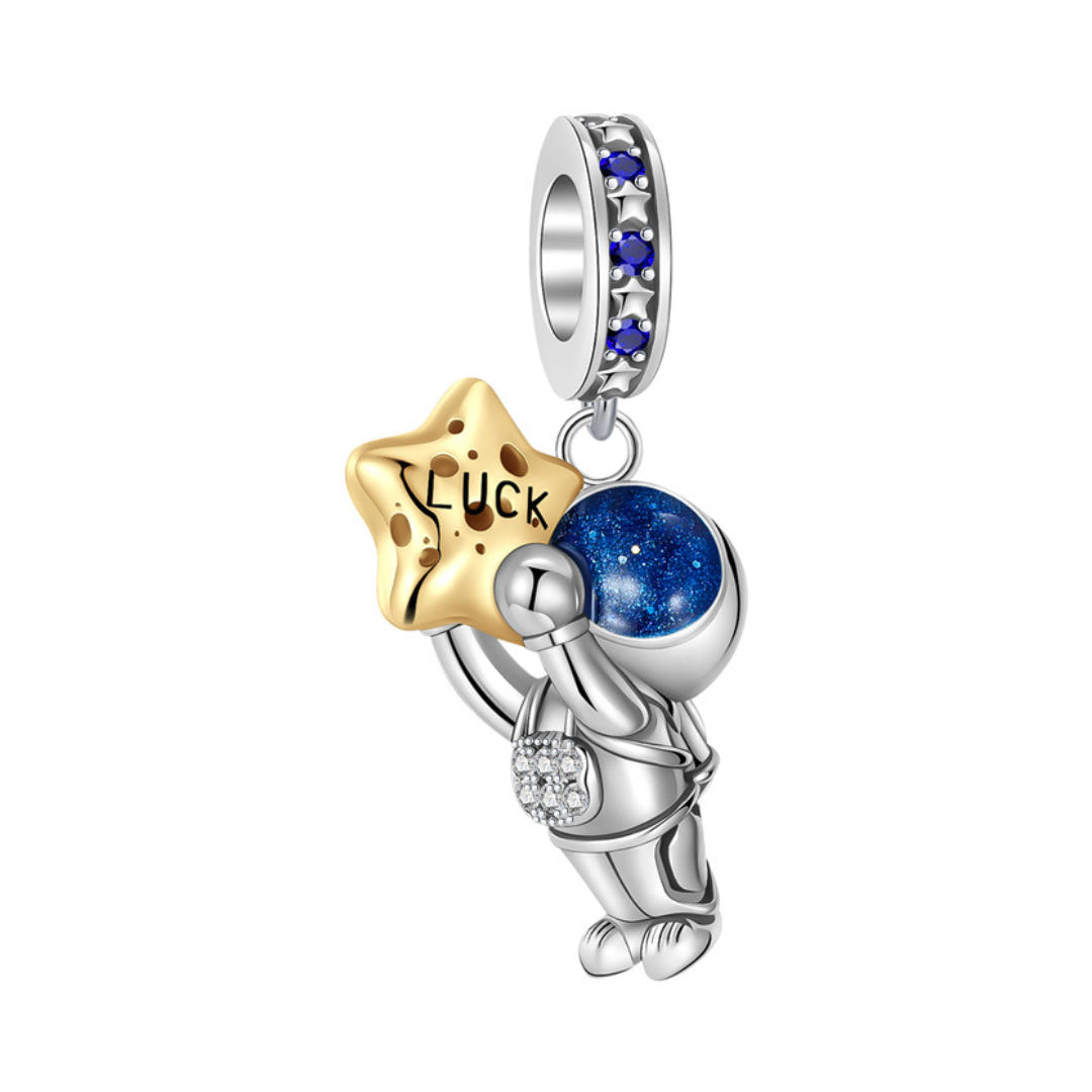 Lucky Star Astronaut Dangle Charm featuring a silver astronaut holding a gold star engraved 'Luck'.