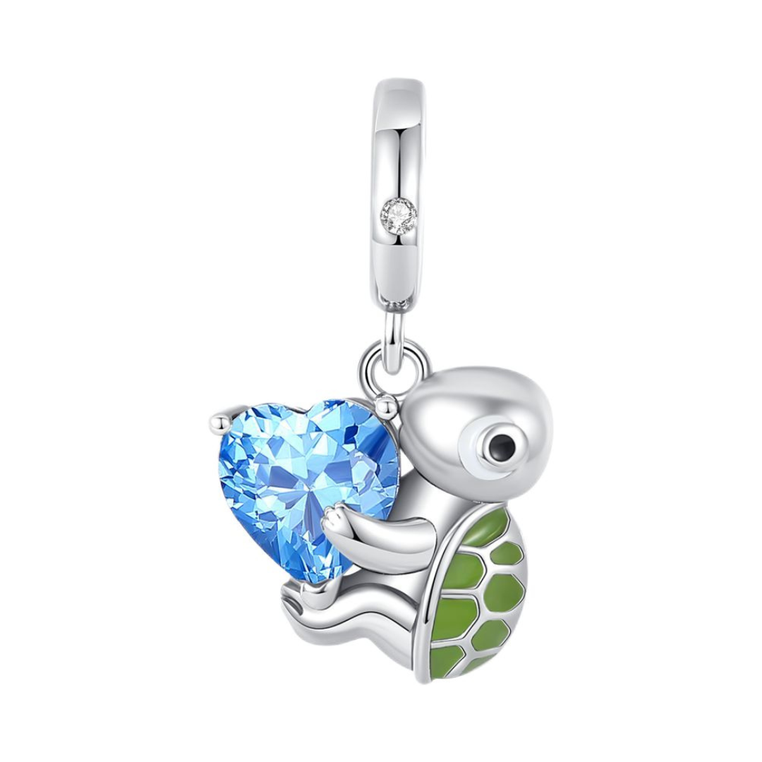 Ocean Love Sea Turtle Heart Dangle Charm featuring a turtle with blue heart stone and green enamel shell.