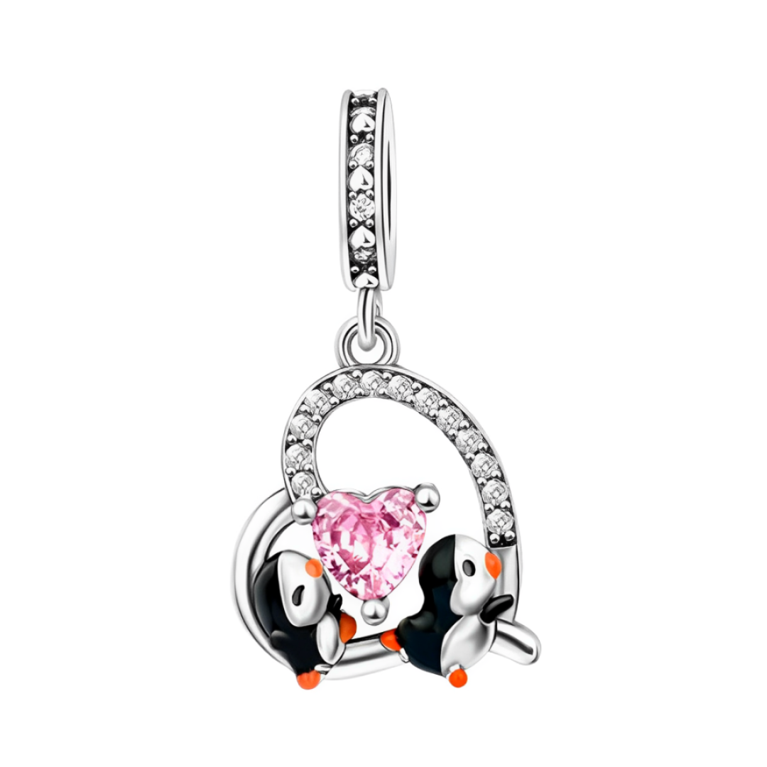 Penguin Couple Sparkling Heart Dangle Charm with two penguins and a pink heart with crystal accents.