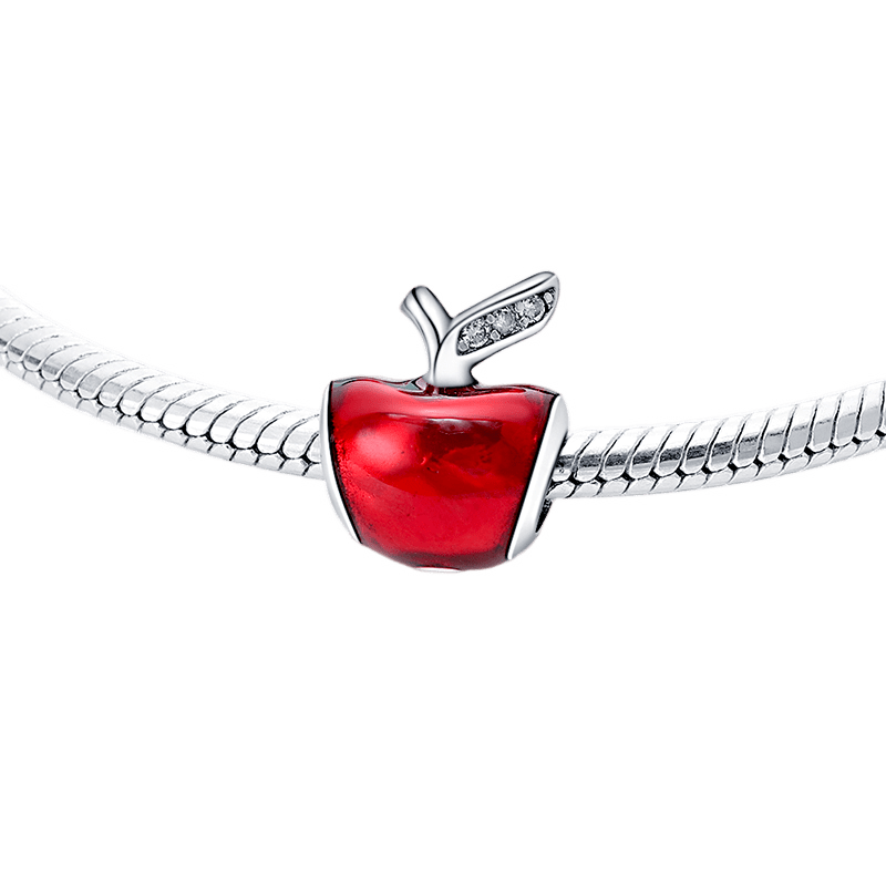 Disney Snow White Apple Charm on a silver bracelet with red apple detail and leaf accent.
