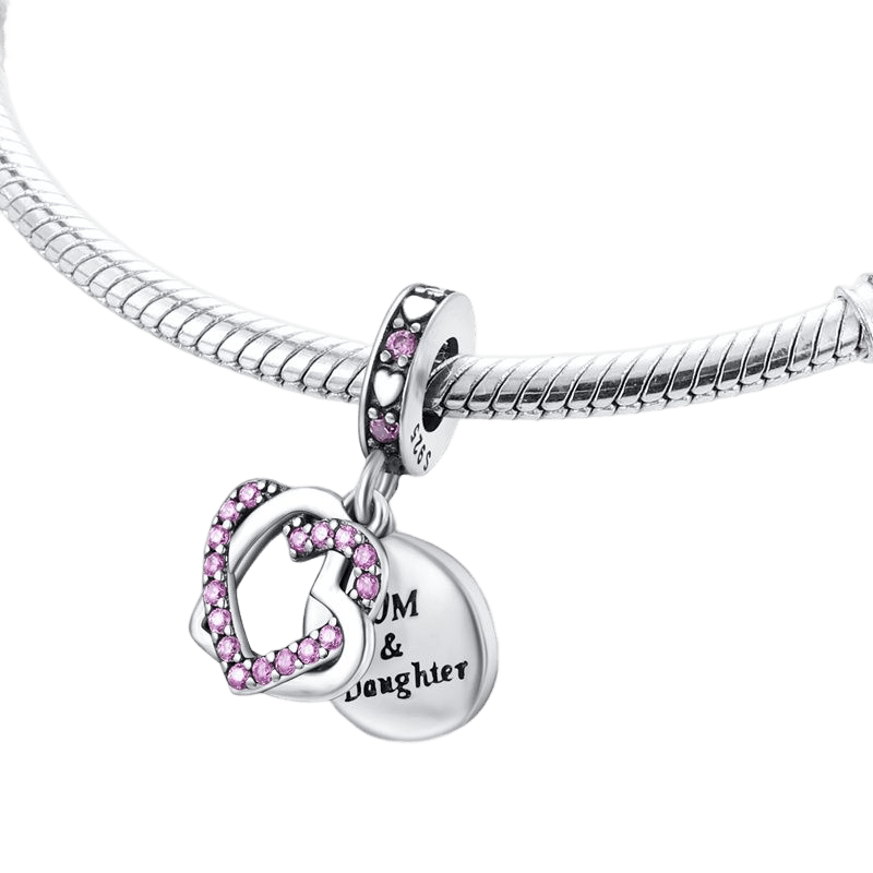 Entwined Mom And Daughter Heart Dangle Charm on a bracelet with pink crystals, symbolizing a mother-daughter bond.