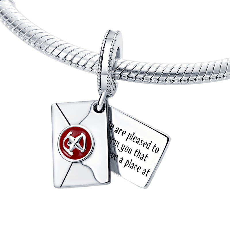 Harry Potter Hogwarts Acceptance Letter Dangle Charm on a charm bracelet, symbolizing magic and new beginnings.