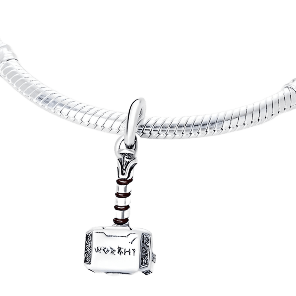 Marvel Thor Mjolnir Hammer Pendant on a silver bracelet, showcasing detailed engraving and brown handle.