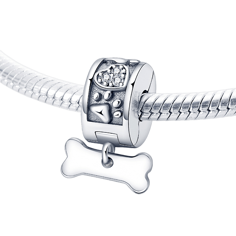 Paw Print & Dog Bone Clip Charm featuring a silver clip with paw prints and a bone dangling beneath.