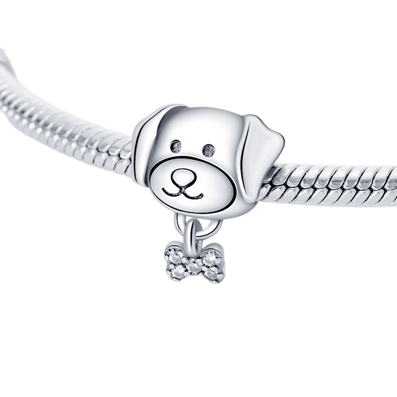 Sparkling Puppy and Bone Charm on a bracelet featuring a cute puppy face and a sparkling bone charm.