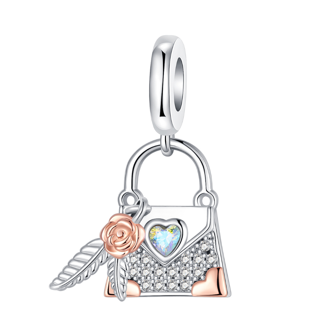 Rose Gold Bloom Sparkling Handbag Dangle Charm with sparkling pavé, rose gold accents, heart stone and feather charm.
