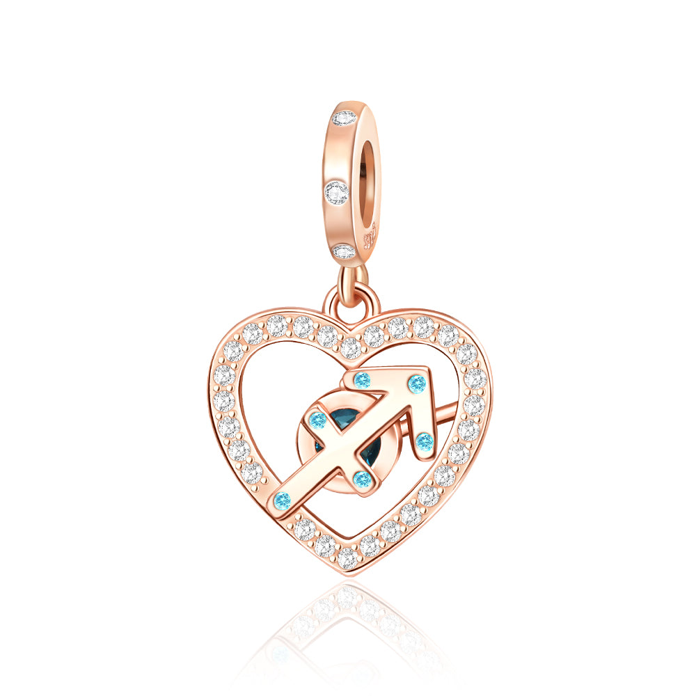 Rose Gold Sparkling Sagittarius Dangle Charm with heart shape, pavé crystals, and teal accents.