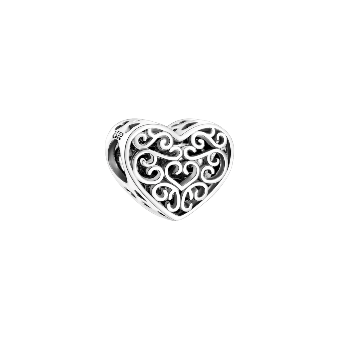 Silver Vintage Lace Heart Charm showcasing delicate scrollwork in a vintage heart design.